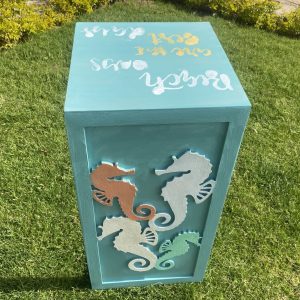 Wooden sofa side table with sea horses collection