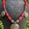 Natural Red Coral Necklace with Siwa Oasis Silver Charms - Handcrafted Artistic Masterpiece . "عقد مرجان أحمر طبيعي مزين بدلايات من تراث واحة سيوة - تحفة فنية يدوية"