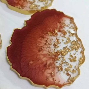 oval bordeaux resin coaster with gold leaves